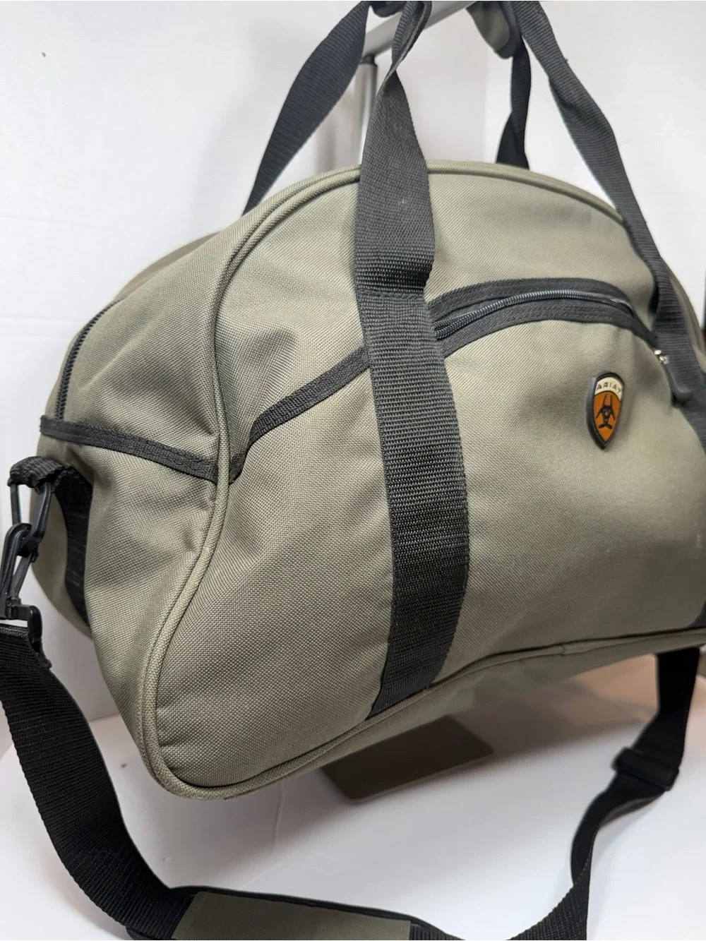 Ariat Olive Green Duffel Bag for Men comes with strap